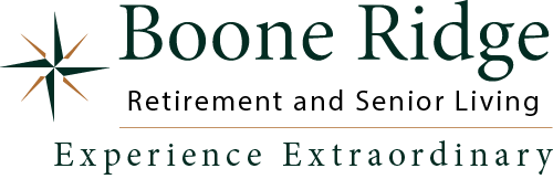 Logo of Boone Ridge Retirement and Senior Living. It features a stylized star on the left and the slogan "Experience Extraordinary" underneath the name.