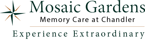 Logo for Mosaic Gardens Memory Care at Chandler, featuring a compass rose design on the left. The text reads "Mosaic Gardens Memory Care at Chandler" and "Experience Extraordinary" below.